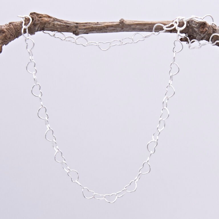 Sterling Silver Heart Link Chain Necklace with spring clasp, shown hanging from twig