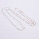 Sterling Silver Small Heart Link Chain Necklace shown on plain white background looped in loose N shape