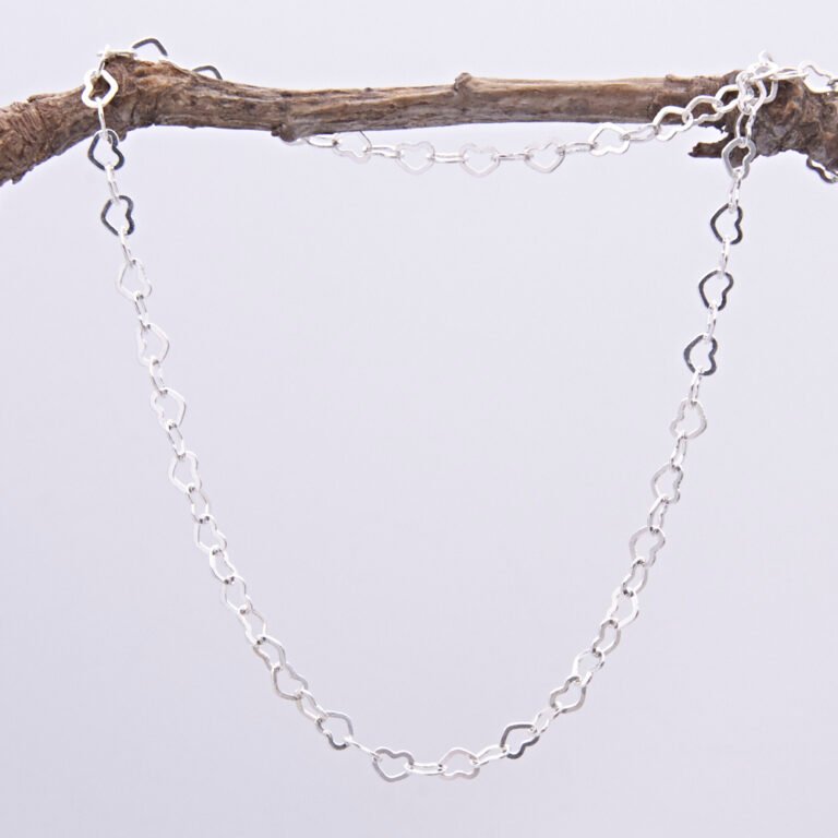 Sterling Silver Small Heart Link Chain Necklace shown hanging from twig