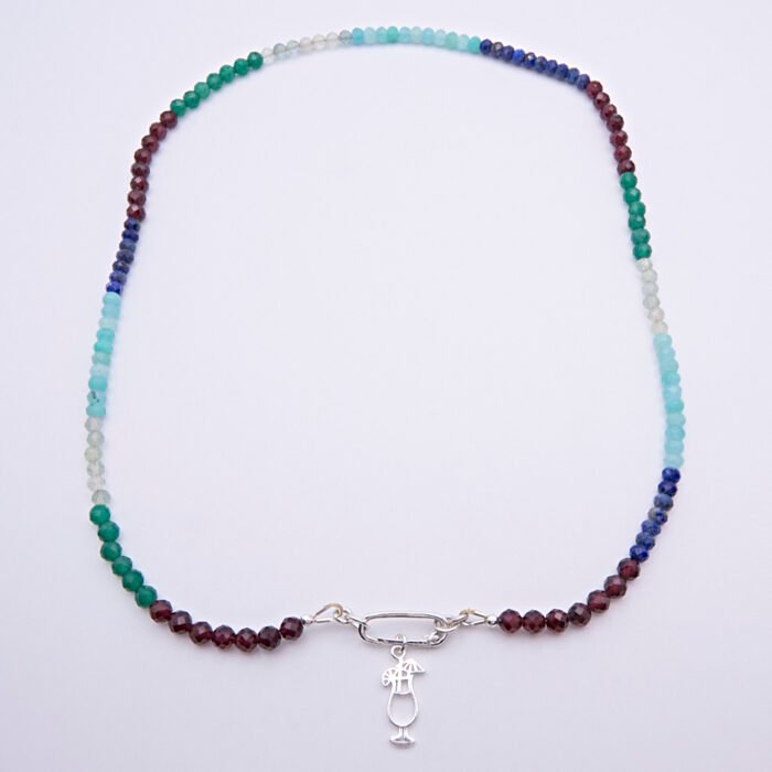 Mixed Gemstone Necklace with Sterling Silver Charm Clasp and Cocktail Charm, shown from above laid flat on plain white background