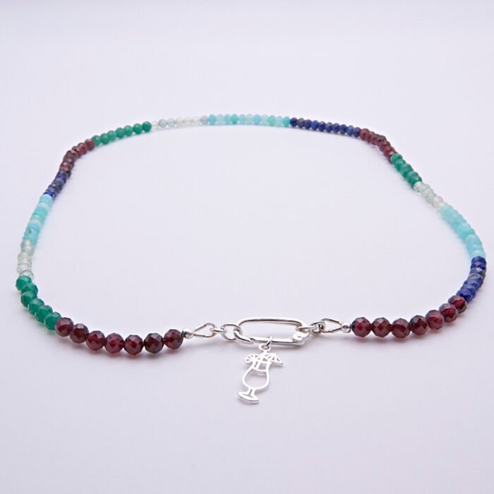 Mixed Gemstone Necklace with Sterling Silver Charm Clasp and Cocktail Charm, image shows necklace laid flat on white surface with focus on the charm clasp, cocktail charm and gemstone beads
