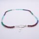 Mixed Gemstone Necklace with Sterling Silver Charm Clasp and Cocktail Charm, image shows necklace laid flat on white surface with focus on the charm clasp, cocktail charm and gemstone beads
