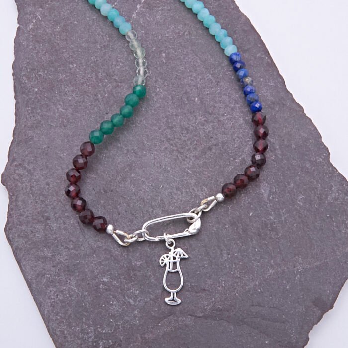 Mixed Gemstone Necklace with Sterling Silver Charm Clasp and Cocktail Charm, image shows close-up of charm clasp and cocktail charm on grey slate