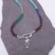 Mixed Gemstone Necklace with Sterling Silver Charm Clasp and Cocktail Charm, image shows close-up of charm clasp and cocktail charm on grey slate