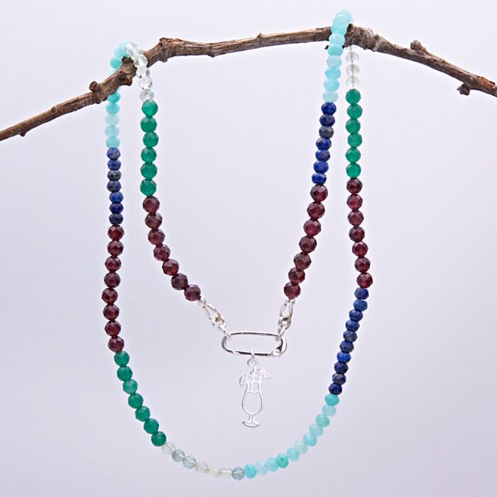 Mixed Gemstone Necklace with Sterling Silver Charm Clasp and Cocktail Charm, shown hanging from twig