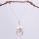 Baroque pear-shaped Freshwater Pearl Necklace shown suspended from twig
