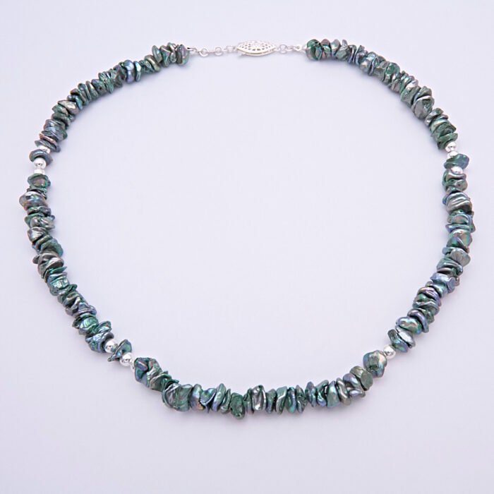 Green Keishi Cornflake Freshwater Pearl and Sterling Silver Necklace, shown from above laid flat on plain white surface, with clasp at the top of the image