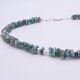 Green Keishi Cornflake Freshwater Pearl and Sterling Silver Necklace, image shows close-up of part of pearl strand and clasp
