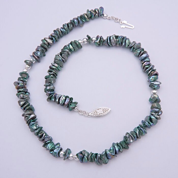 Green Keishi Cornflake Freshwater Pearl and Sterling Silver Necklace, image shows necklace unfastened, in a loose spiral, on plain white background, viewed from above