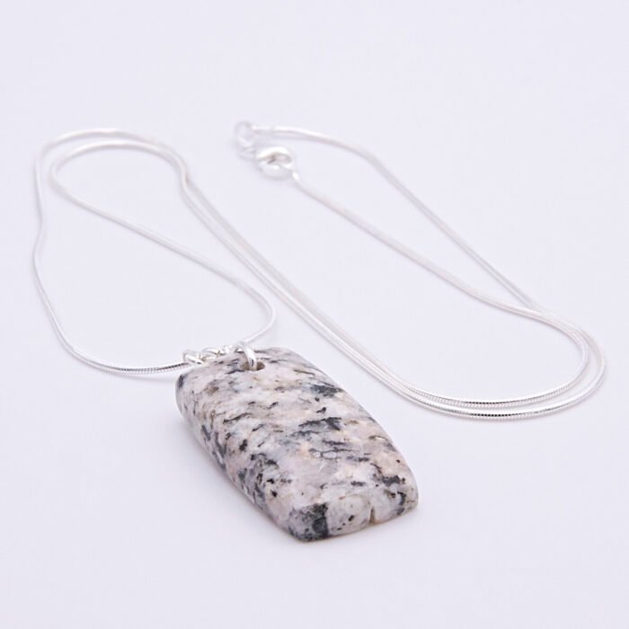 Edinburgh Royal Mile Cobblestone Pendant on Sterling Silver Snake Chain, shown on plain white background with chain loosely curved in an N shape, cobblestone pendant is bottom centre of the image
