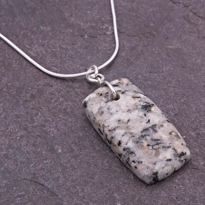 Edinburgh Royal Mile Cobblestone Pendant on Sterling Silver Snake Chain, shown close-up on dark slate