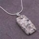 Edinburgh Royal Mile Cobblestone Pendant on Sterling Silver Snake Chain, shown close-up on dark slate