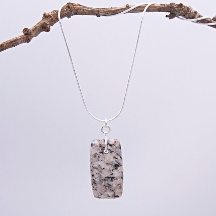 Edinburgh Royal Mile Cobblestone Pendant on Sterling Silver Snake Chain, shown hanging from twig