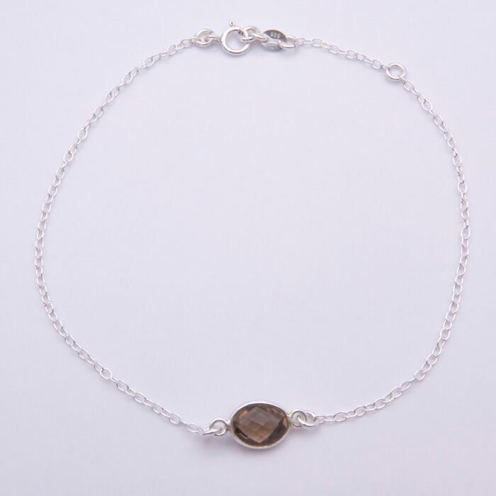 Smoky Quartz Oval Bezel-set Gemstone Sterling Silver Bracelet, shown from above on plain white background, with extender chain fully in use