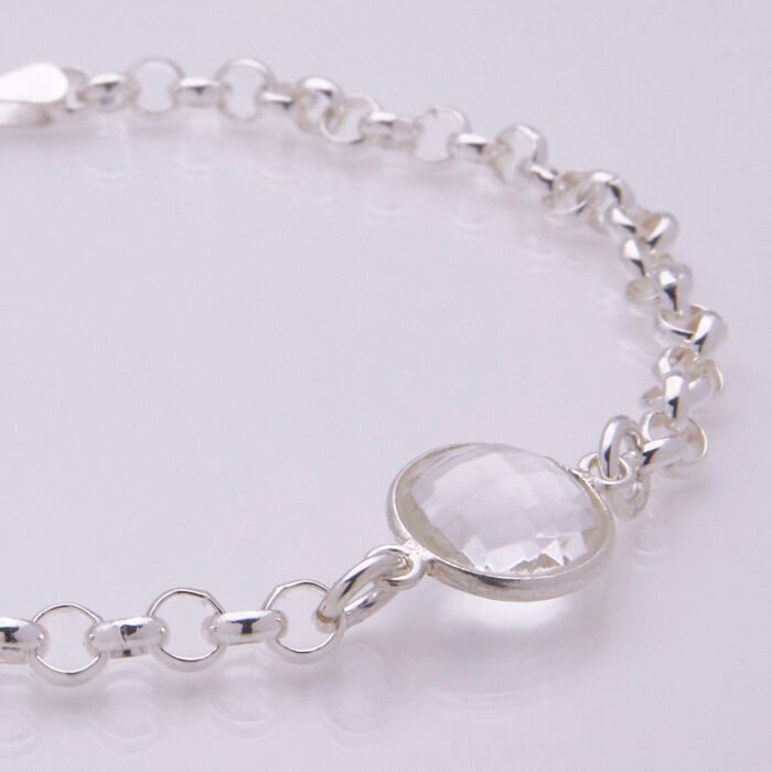 Crystal Quartz Chunky Belcher Chain Sterling Silver Bracelet, image shows close-up of Crystal Quartz stone and part of the chain, on plain white background