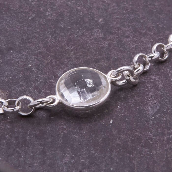 Crystal Quartz Chunky Belcher Chain Sterling Silver Bracelet, image shows close-up of Crystal Quartz stone on dark grey slate
