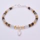 Smoky Quartz, Green Amethyst and Citrine Sterling Silver bracelet with 3D leaf charm, shown on plain white background with clasp at the top and leaf at the bottom