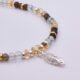 Smoky Quartz, Green Amethyst and Citrine Sterling Silver bracelet with 3D leaf charm, image shows close-up of leaf charm and beads on either side, on plain white background