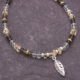 Smoky Quartz, Green Amethyst and Citrine Sterling Silver bracelet with 3D leaf charm, image shows close-up view of leaf and part of beaded section, shown on dark slate background
