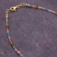 Autumn Colours Mixed Gemstone Gold Vermeil Bracelet, image shows part of gemstone strand and clasp on dark slate background