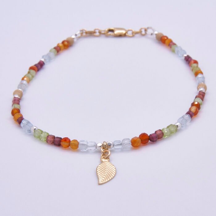 Mixed Metals Gemstone Bracelet with Gold Leaf Charm, image shows bracelet viewed from the front, on plain white background
