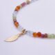 Mixed Metals Gemstone Bracelet with Gold Leaf Charm, image shows close-up of leaf and part of gemstone strand, on plain white background