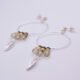 Mixed Metals Leaf Charm Gemstone Hoop Earrings, shown laid at an angle on plain white background
