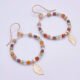 Gold Filled Gemstone Hoop Earrings with Gold Leaf Charm, shown laid flat on plain white background