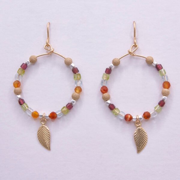 Gold Filled Gemstone Hoop Earrings with Gold Leaf Charm, shown hanging from display card