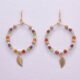 Gold Filled Gemstone Hoop Earrings with Gold Leaf Charm, shown hanging from display card