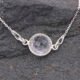 Smoky Quartz or Crystal Quartz round bezel set faceted gemstone Sterling Silver necklace Smoky Quartz or Crystal Quartz round bezel set faceted gemstone Sterling Silver necklace, images shows close-up of Crystal Quartz gemstone on dark stone