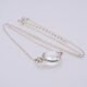 Smoky Quartz or Crystal Quartz round bezel set faceted gemstone Sterling Silver necklace Smoky Quartz or Crystal Quartz round bezel set faceted gemstone Sterling Silver necklace, image shows close-up of Crystal Quartz stone viewed from the side