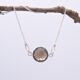 Smoky Quartz or Crystal Quartz round bezel set faceted gemstone Sterling Silver necklace Smoky Quartz or Crystal Quartz round bezel set faceted gemstone Sterling Silver necklace, image shows Smoky Quartz necklace hanging from twig