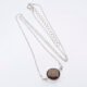 Smoky Quartz or Crystal Quartz round bezel set faceted gemstone Sterling Silver necklace Smoky Quartz or Crystal Quartz round bezel set faceted gemstone Sterling Silver necklace, image shows Smoky Quartz necklace from above on plain white background with stone at the bottom of the image