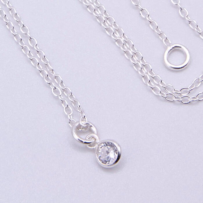 Cubic Zirconia Bezel-set stone on Sterling Silver Chain, image shows close-up of stone on plain white background