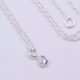 Cubic Zirconia Bezel-set stone on Sterling Silver Chain, image shows close-up of stone on plain white background