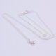 Cubic Zirconia Bezel-set stone on Sterling Silver Chain, image shows necklace on plain white background with the stone at the bottom of the image
