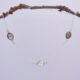 Smoky Quartz and Crystal Quartz 3-stone bezel-set Necklace on Sterling Silver Chain, shown hanging from twig
