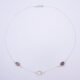 Smoky Quartz and Crystal Quartz 3-stone bezel-set Necklace on Sterling Silver Chain, shown from above on white background, with clasp at the top and stones at the bottom