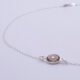 Smoky Quartz and Crystal Quartz 3-stone bezel-set Necklace on Sterling Silver Chain, image shows close-up of Smoky Quartz stone and part of chain, on white background