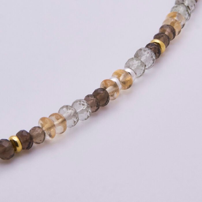 Leaf Charm Mixed Gemstone Necklace, image shows close-up of part of gemstone strand on plain white background