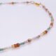 Autumn Colours Mixed Gemstone Gold Vermeil Necklace, images shows close-up of part of gemstone strand and clasp, on plain white background