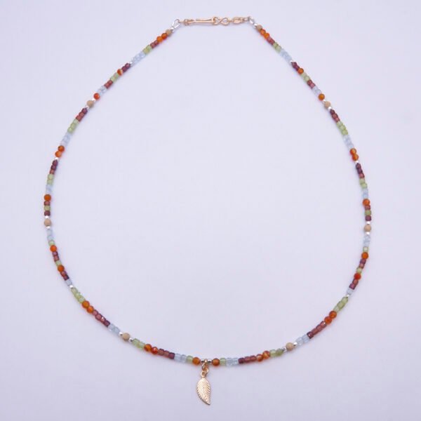 Mixed Metals Gemstone Necklace with Gold Leaf Charm, image shows necklace viewed from above on plain white background