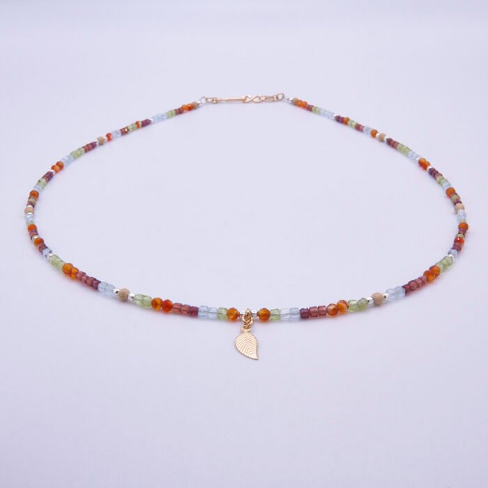 Mixed Metals Gemstone Necklace with Gold Leaf Charm, image shows necklace from the front on plain white background