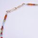 Mixed Metals Gemstone Necklace with Gold Leaf Charm, image shows close-up of clasp, on plain white background