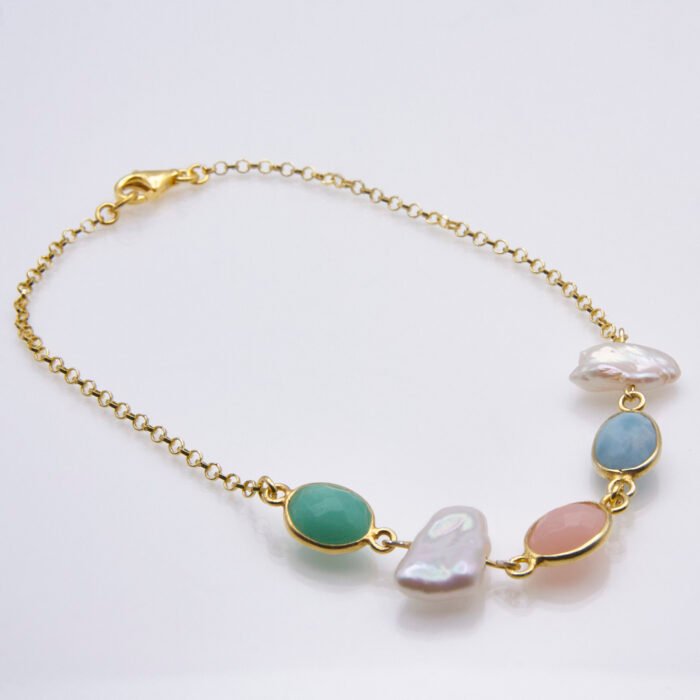 Mixed Bezel-set Pastel Gemstone and Freshwater Pearl Bracelet Mixed Bezel-set Pastel Gemstone and Freshwater Pearl Bracelet, image shows bracelet viewed from the side, on plain white background