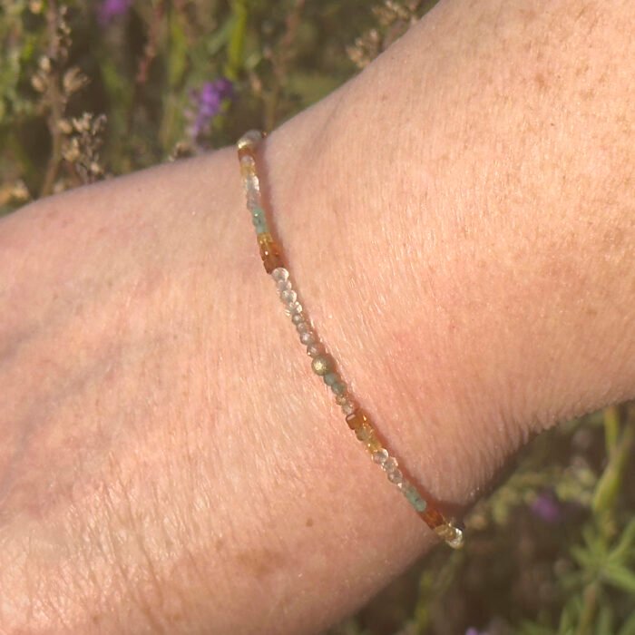 Image of mixed gemstone bracelet worn on wrist