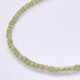 Peridot and Sterling Silver Bracelet, image shows close-up of part of gemstone strand on plain white background