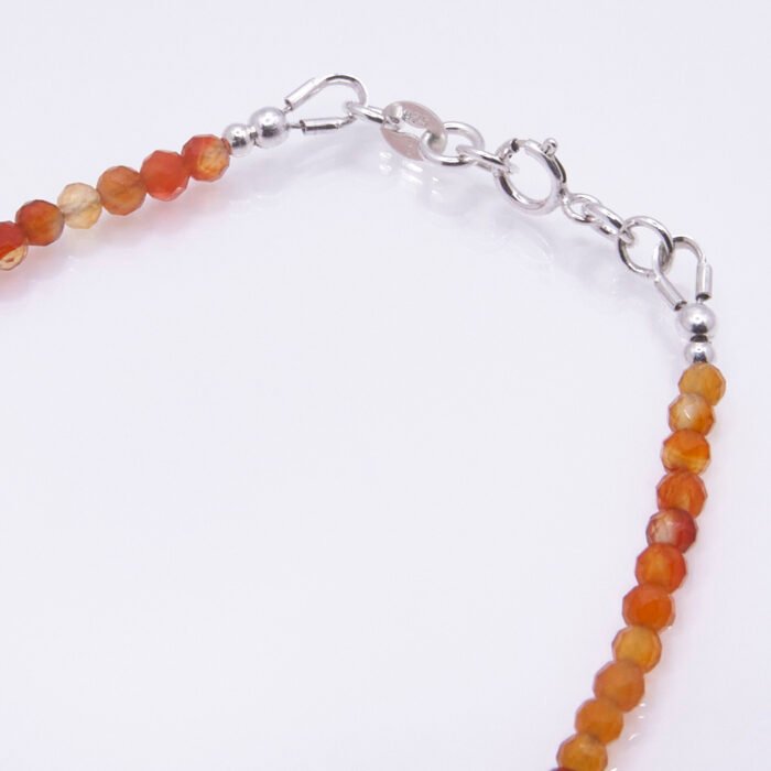 Carnelian and Sterling Silver Bracelet, image shows close-up of clasp and part of gemstone strand on plain white background
