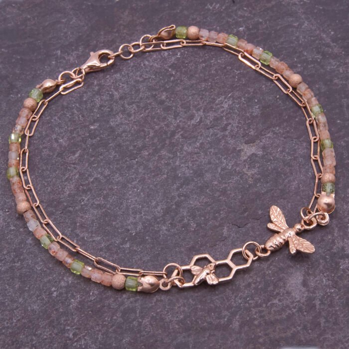 Rose Gold Bee and Gemstone Bracelet, image shows bracelet on dark slate background